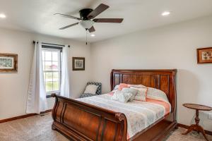 a bedroom with a bed and a ceiling fan at Pet Friendly Daydreamers Guest Ranch on 60 Acres in Lingle