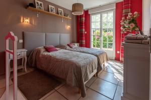 Ένα ή περισσότερα κρεβάτια σε δωμάτιο στο Gîte Nature en Champagne