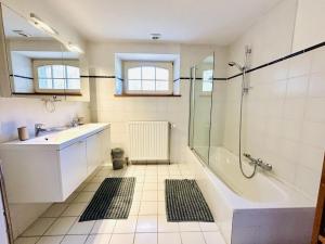 a bathroom with a tub and a sink and a shower at Le Clos du Parc in Offagne +45 photos