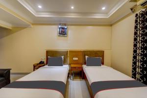 Postel nebo postele na pokoji v ubytování Super Hotel O G Silver Ashok Nagar