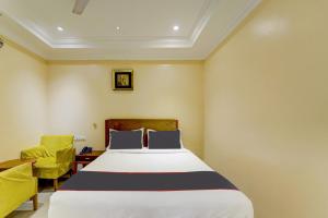 Postel nebo postele na pokoji v ubytování Super Hotel O G Silver Ashok Nagar