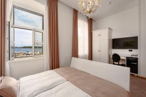 Ένα ή περισσότερα κρεβάτια σε δωμάτιο στο Mas Plaza rooms - Adults only
