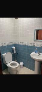 a bathroom with a toilet and a sink at Hanae malabata in Tangier +17 photos