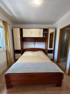 a bedroom with a bed in a room at Apartment Orebic 10082b in Orebić