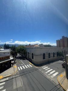 an aerial view of an empty street with a building at Apart Chacabuco in San Fernando del Valle de Catamarca