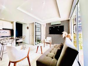 TV a/nebo společenská místnost v ubytování Apartamento mirador urbano estilo moderno y Central