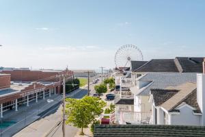 a city street with a ferris wheel in the distance at Coastal Chateau in Ocean City