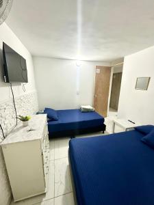 Postel nebo postele na pokoji v ubytování Hostal Campo Amor