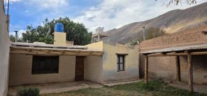 a building with a blue object on top of it at Casa en Tilcara - Espaciosa, equipada y lista para disfrutar in Tilcara