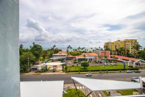 a view of a city with a street and buildings at Viva Jaco in Jacó
