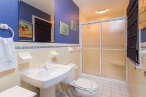 a bathroom with a toilet and a sink and a shower at Henlopen avenue 58 in Rehoboth Beach +11 photos