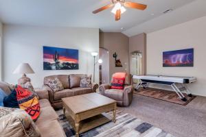 a living room with couches and a pool table at Palmen Maricopa in Maricopa