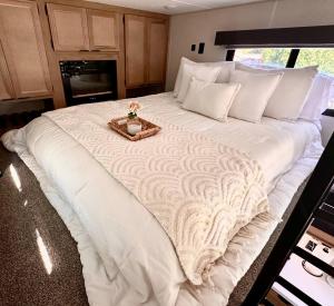 a large white bed in an rv at The Loft | Creekside in Mansfield
