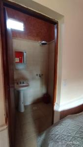 a bathroom with a sink and a shower with a toilet at Finca la milagrosa in Santiago del Estero