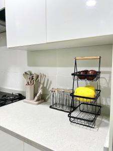 a kitchen counter with a basket of food on it at Modern 2Bedroom Apartment in Lekki in Ikate