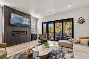 a living room with a couch and a fireplace at Cottonrose Flagstaff in Flagstaff