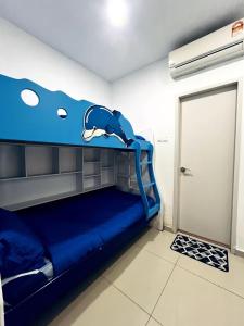 a room with a blue bunk bed with a dolphin on it at Blissful Homes at i-City - WiFi TV Box 1 Carpark in Shah Alam