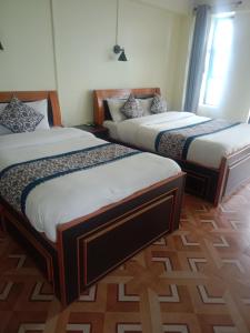 Postel nebo postele na pokoji v ubytování Hotel View Point Nagarkot