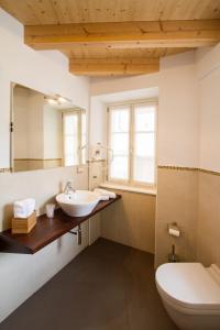 a bathroom with a sink and a toilet at Hotel All'Arco in Trieste