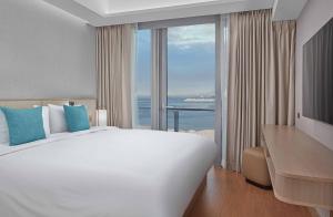 Lanson Place Mall of Asia Manila客房内的一张或多张床位