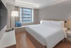 Lanson Place Mall of Asia Manila客房内的一张或多张床位