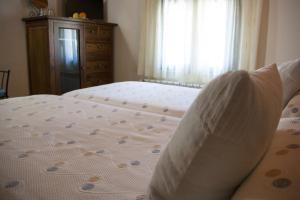 Postel nebo postele na pokoji v ubytování Hostal El Recanto