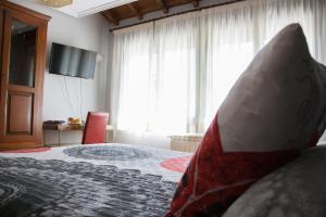 Postel nebo postele na pokoji v ubytování Hostal El Recanto