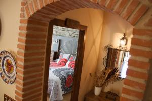 Postel nebo postele na pokoji v ubytování Hostal El Recanto