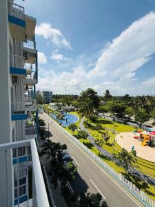 a view of the pool from the balcony of a building at Airport S4 Apartment in Negombo