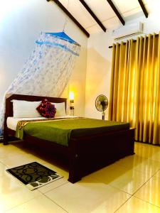A bed or beds in a room at Priyavimana resort