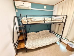 Postel nebo postele na pokoji v ubytování 宿のきむら