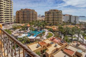 an aerial view of a resort with a pool and buildings at Bella Sirena in La Choya