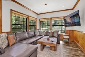 a living room with a couch and a coffee table at Serenity Cove Lake House #2472 by Big Bear Vacations in Big Bear Lake