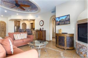 a living room with a couch and a fireplace at Bella Sirena BA 505 As Good As It Gets Beautiful Ocean View Condo in Puerto Peñasco