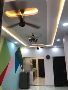 a ceiling in a room with a ceiling fan at Garden view homestay fully furnished new in Jabalpur