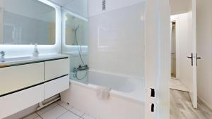 Kúpeľňa v ubytovaní Grand appartement lumineux