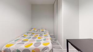 Posteľ alebo postele v izbe v ubytovaní Grand appartement lumineux