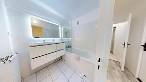 Kúpeľňa v ubytovaní Grand appartement lumineux
