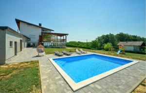 a swimming pool in the backyard of a house at Modern Home With Pool And View in Popovača +33 photos