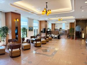 a lobby of a hospital with chairs and tables at Route Inn Grantia Shiretoko -Shari Ekimae- in Shari +20 photos