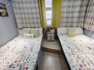 Voodi või voodid majutusasutuse AMU Dreamhouse 阿木旅舍 toas