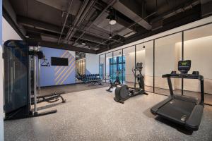 a gym with treadmills and cardio equipment in a room at Holiday Inn Express Nalati By IHG in Narat