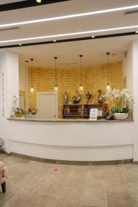 a lobby of a store with a counter at Hotel Mille Amici in Shëngjin +107 photos