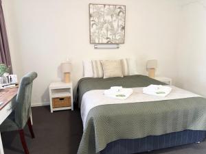Barossa Palms Motel客房内的一张或多张床位