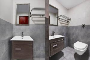 a bathroom with a toilet and a sink and a mirror at Super Townhouse Oak Anu Hospital Elur Road Formerly Grand Tankasala in Gunadala +25 photos