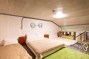 เตียงในห้องที่ 富貴民宿Full Great B&B包棟名宿