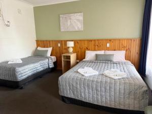 Barossa Palms Motel客房内的一张或多张床位