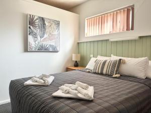 Barossa Palms Motel客房内的一张或多张床位