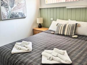 Barossa Palms Motel客房内的一张或多张床位