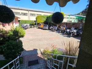 a parking lot with motorcycles parked in front of a building at Penzión Tiberia in Trenčín